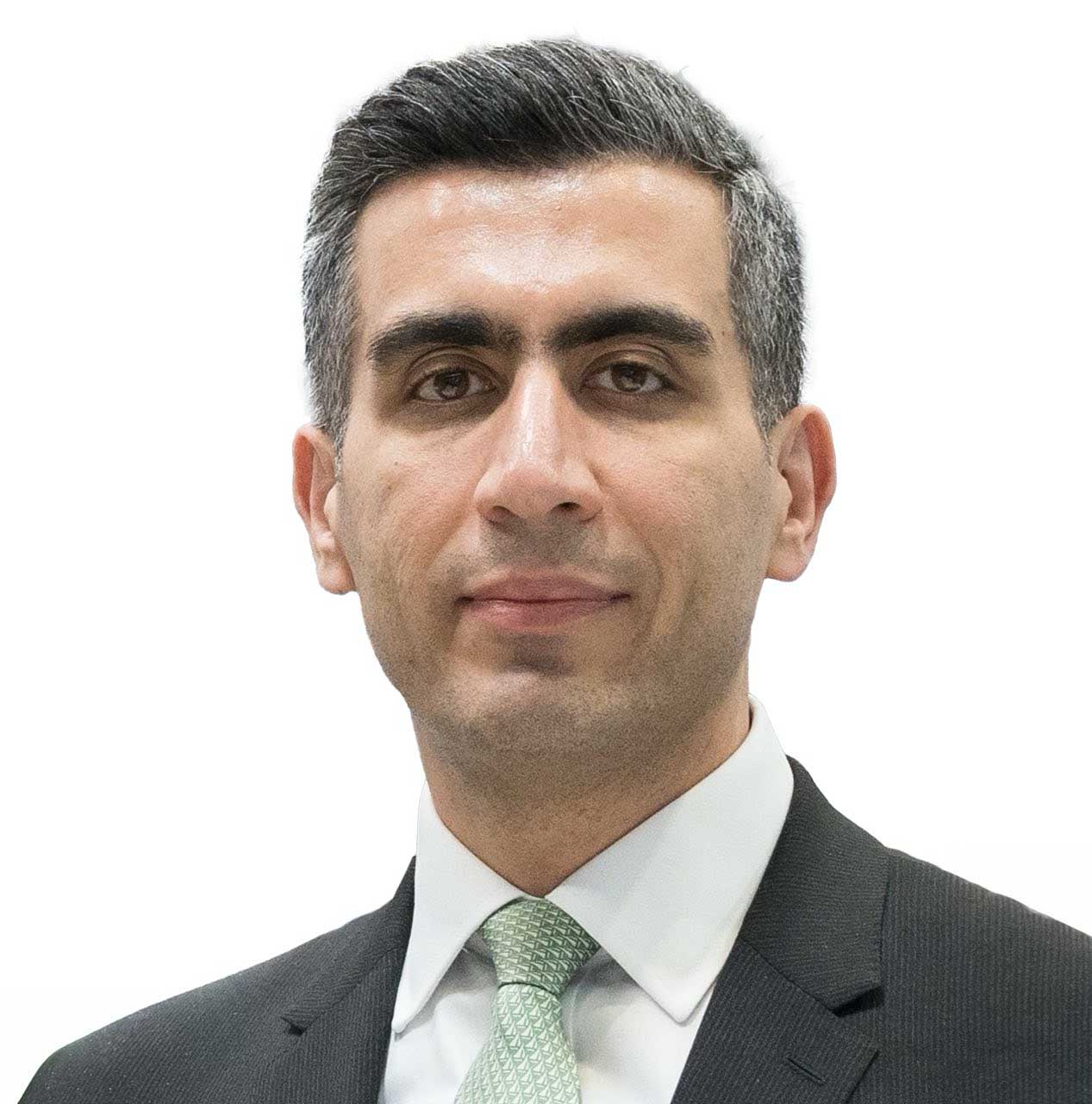 Professional portrait of Ali Aydan wearing a black suit, white shirt, and a light green patterned tie against a plain white background.