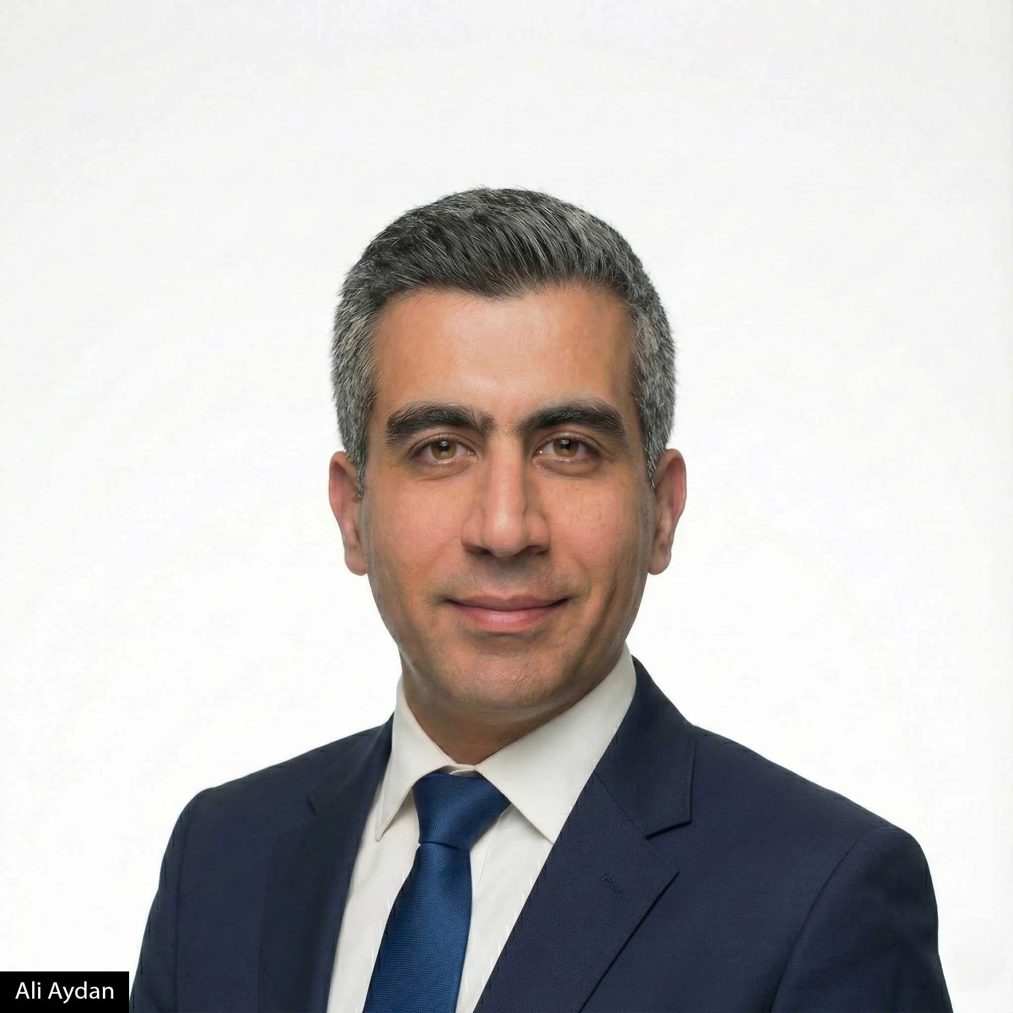 Professional executive portrait illustrating Ali Aydan’s perspective on zero-latency leadership, organizational simplicity, and scalable decision-making.