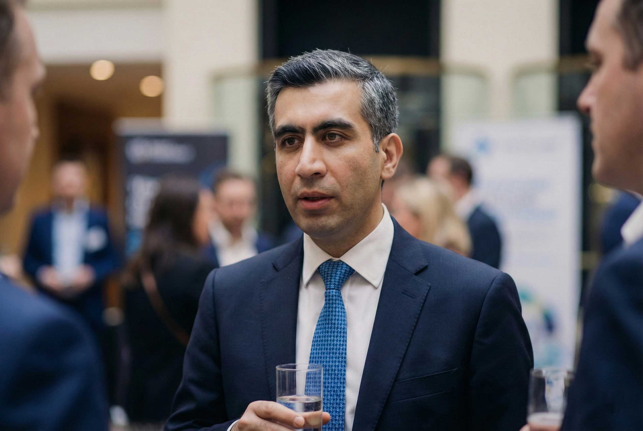 Ali Aydan networking at a corporate business event
